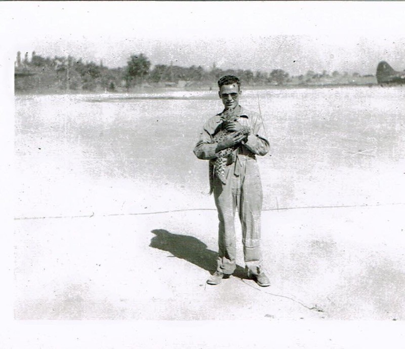 Click image for larger version  Name:	Grandfather holding a baby leopard on the tarmac in India, WWII.jpg Views:	1 Size:	103.1 KB ID:	22291
